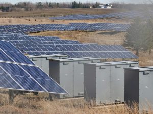 vast solar farm under blue sky in rural landscape